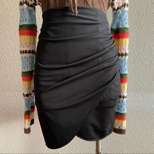 Y2K style black mini skirt with ruched detailing